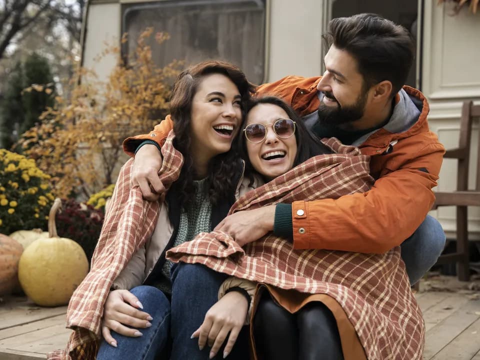 Friends greeting each other with a hug